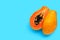 Papaya fruit on blue background