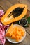 Papaya fruits on wooden backgroud, fresh ripe papaya slice on white plate tropical fruit with papaya seed and leaf leaves from