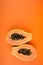 Papaya, Sliced papaya isolated on orange background. copy space