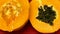 Papaya- a tropical fruit shaped like an elongated melon, with edible orange flesh and small black seed