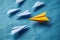 Paper airplane metaphor yellow origami leading white paper airplanes