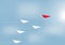 Paper airplanes flying with red airplane changing direction ahead, business competition leadership ambitious successful concept