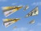 Paper airplanes made of a 200 Euro notes fly past planes made of a US 100 dollar note