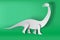 Paper art of Apatosaurus dinosour on green background vector