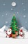 Paper art, Craft style of Santa Claus with friends with Christmas tree at snow mountain