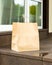 Paper bag, contactless delivery.