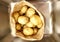A paper bag full of potatoes