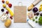 Paper bag of healthy organic food on white wooden background. Cooking food background. Flat-lay of fresh fruits, veggies, greens,