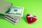 Paper bag with money decorative heart St. Valentine`s Day