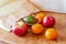 Paper bags, fresh vegetables and fruits on a kitchen table