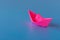 Paper boat on a blue background. Columbus Day