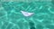 Paper Boat on blue water with waves. Small White Boat from Paper on Sunny Summer day. Concept Travel, Tourism, Vacation