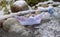 The paper boat marked help was stuck among the plastic bottles frozen in the water