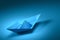 Paper boat sailing. Paper boat blue color on sea wave metaphor. Blue ship sailboat