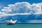 Paper Boat in the Sea under the Sky with Cumulonimbus and Torrential Rain