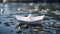 paper boat on the water A conceptual image of a white paper boat , floating on water rocks and waves