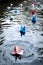 paper boats in water, demonstrating synchronized effort