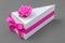 Paper box made as piece of cake. Original small gift box decorated with ribbon and rose