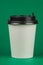 Paper coffee container with black lid. Take-away beverage contai