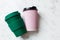 Paper coffee cup and bamboo reusable drink mug