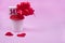 Paper coffee cups and gift box with number 14 on pink Valentineâ€™s day background. Red heats. Coffee holiday delivery concept.