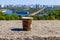 Paper cup of coffee on stone parapet overlooking Kiev cityscape, Ukraine