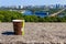 Paper cup of coffee on stone parapet overlooking Kiev cityscape, Ukraine