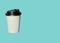 Paper cup with hot coffee to go isolated on a light blue background. Take away drinks, fast food. Copy space, price tag