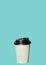 Paper cup with hot coffee to go isolated on a light blue background. Take away drinks, fast food. Copy space, price tag