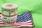 Paper currency roll 1040 form US flag rubber band