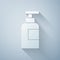 Paper cut Bottle of shampoo icon isolated on grey background. Paper art style. Vector