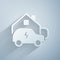 Paper cut Electric car parking charging at home wall box charger station on house icon isolated on grey background