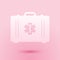 Paper cut First aid kit and Medical symbol of the Emergency - Star of Life icon isolated on pink background. Medical box