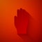 Paper cut Medical rubber gloves icon isolated on red background. Protective rubber gloves. Paper art style. Vector