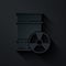 Paper cut Radioactive waste in barrel icon isolated on black background. Toxic refuse keg. Radioactive garbage emissions