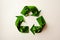 A paper-cut recycling symbol with interconnected arrows, symbolizing the importance of recycling and waste reduction