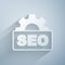 Paper cut SEO optimization icon isolated on grey background. Paper art style. Vector