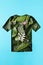 Paper cut t-shirt shape filled with green leaves. Organic cotton production