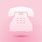 Paper cut Telephone icon isolated on pink background. Landline phone. Paper art style. Vector