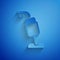 Paper cut Vacuum cleaner icon isolated on blue background. Paper art style. Vector