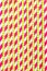 Paper drinking straws plastic pink color. Vertical background