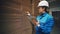 Paper factory. An engineer inspects a cardboard warehouse. Box production