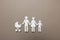 Paper family figures on light grey background, top view. Insurance concept