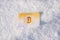 Paper gold money bitcoin in the snow in winter. Frozen account.