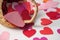 Paper heart falling from wooden basket on white background - valentine`s day concept