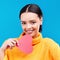 Paper heart, portrait and happy woman on blue background, love icon and romantic flirting sign. Female model, emoji