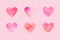 Paper hearts aligned on pink background minimal valentines day card