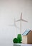 Paper model of wind turbine and model of trees on the table