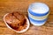 Paper molds and muffins on wooden table