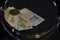 Paper money and vintage currency of Brazil in mirror reflection on black background